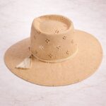 Lena safari straw sun hat with diamond perforations and tassel trim