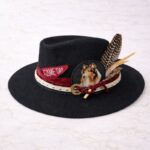 Game Day maroon and white wide brim Australian 100% wool felt hat by American Hat Makers, styled by Swanky Doodle in Fort Worth TX with collie patch, horseshoe pin, maroon chiffon ribbon, studded white leatherette band, and brown-white feathers